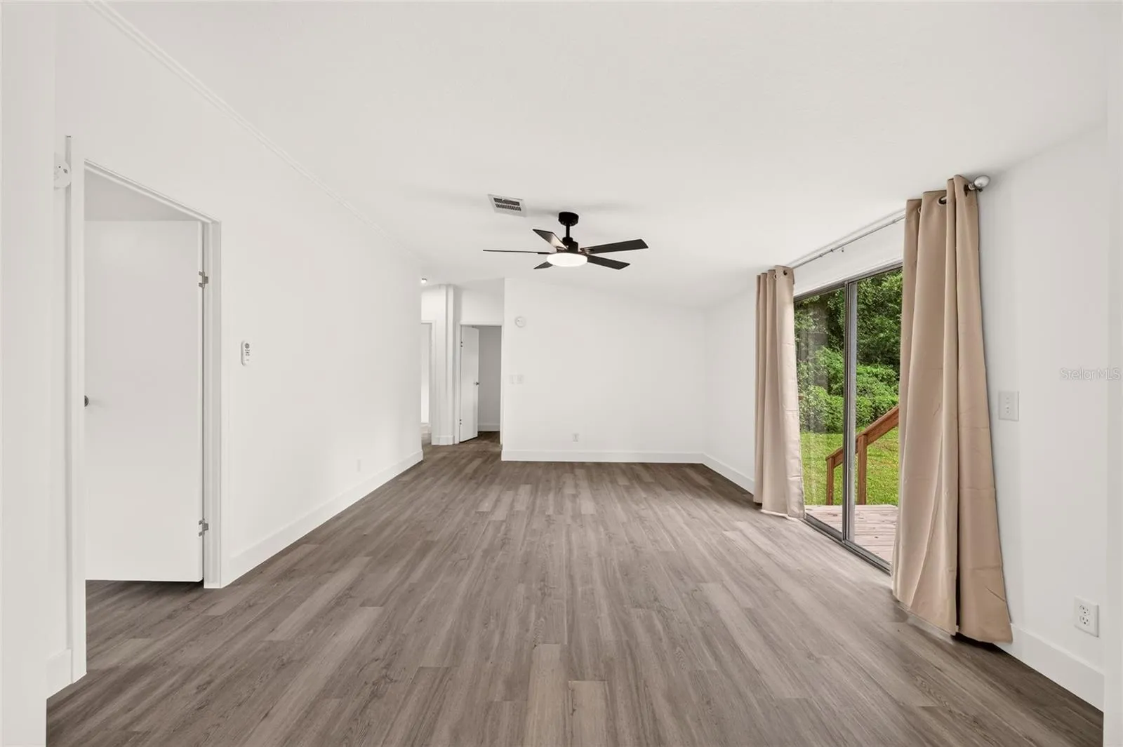 Family room door entrance to the left 5th bedroom with closet or office, sliding door exits to back yard
