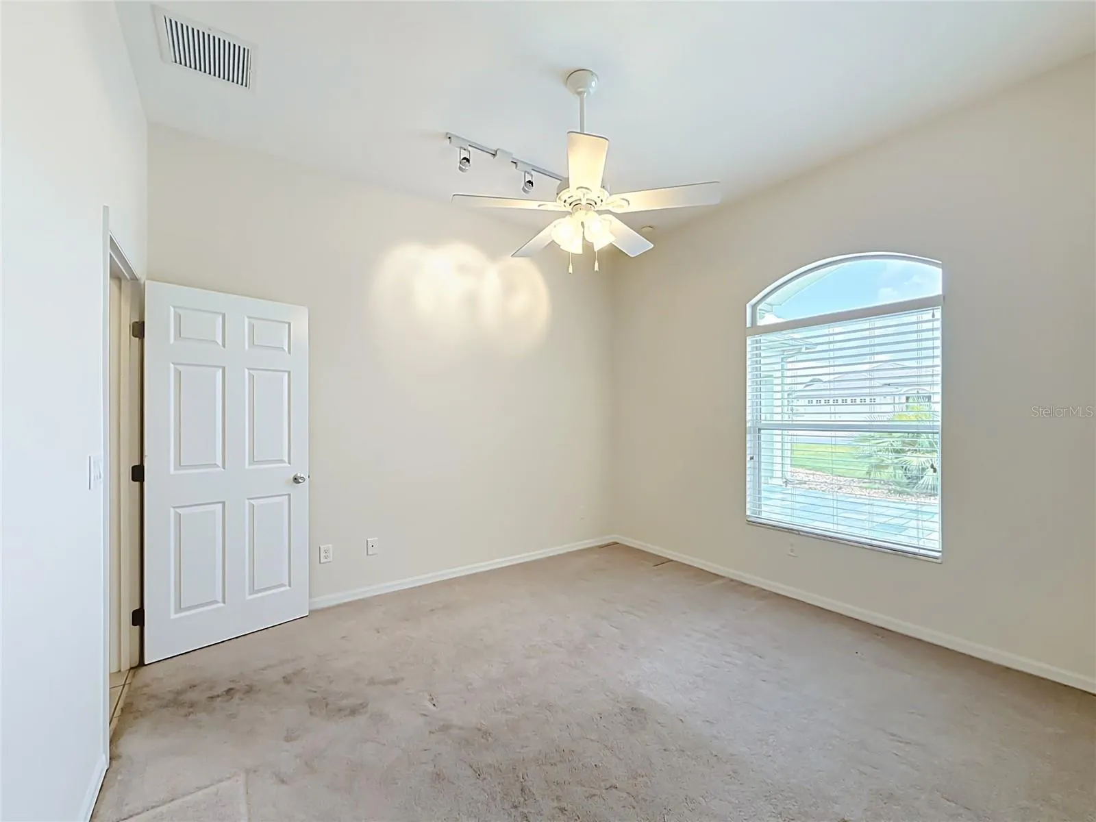 Trac lights, ceiling fan w/ lights.