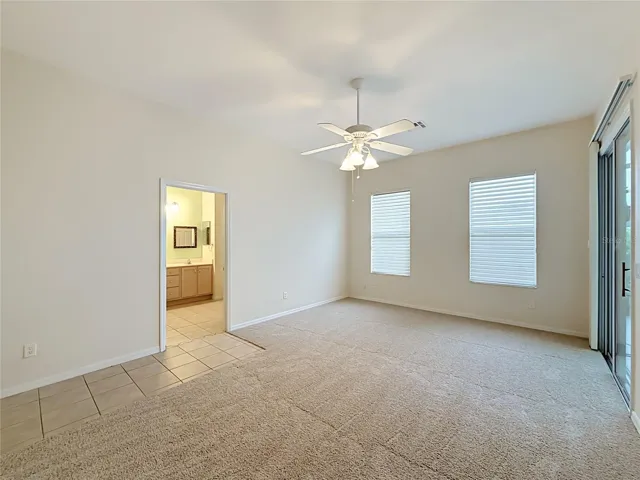 Primary ensuite with slider to The Florida room.