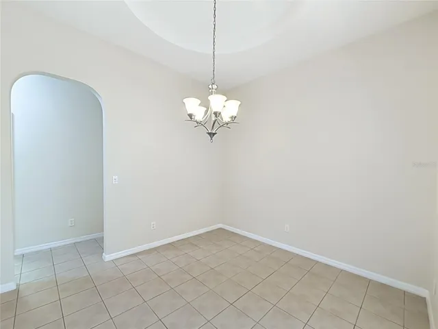 Arched doorways, tray ceiling, smooth ceilings