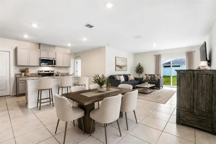 virtually staged dining kitchen living room combo