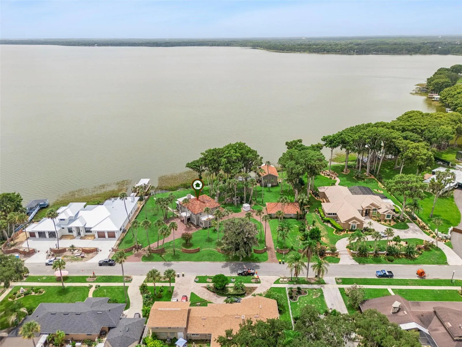 Elevated perspective of the estate and its direct lakefront position
