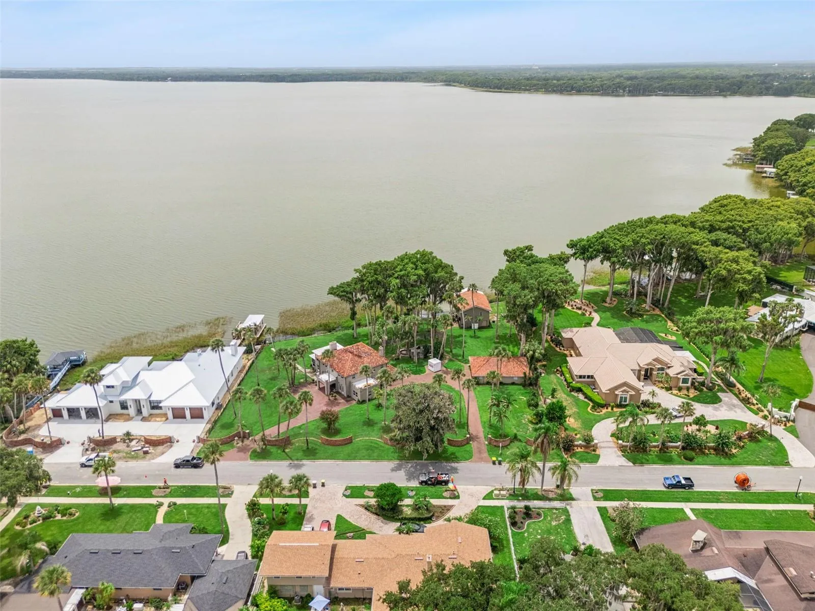 Elevated perspective of the estate and its direct lakefront position