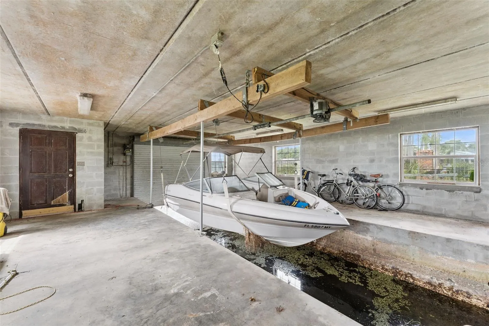 Covered boat storage with direct lake access, no trailer needed