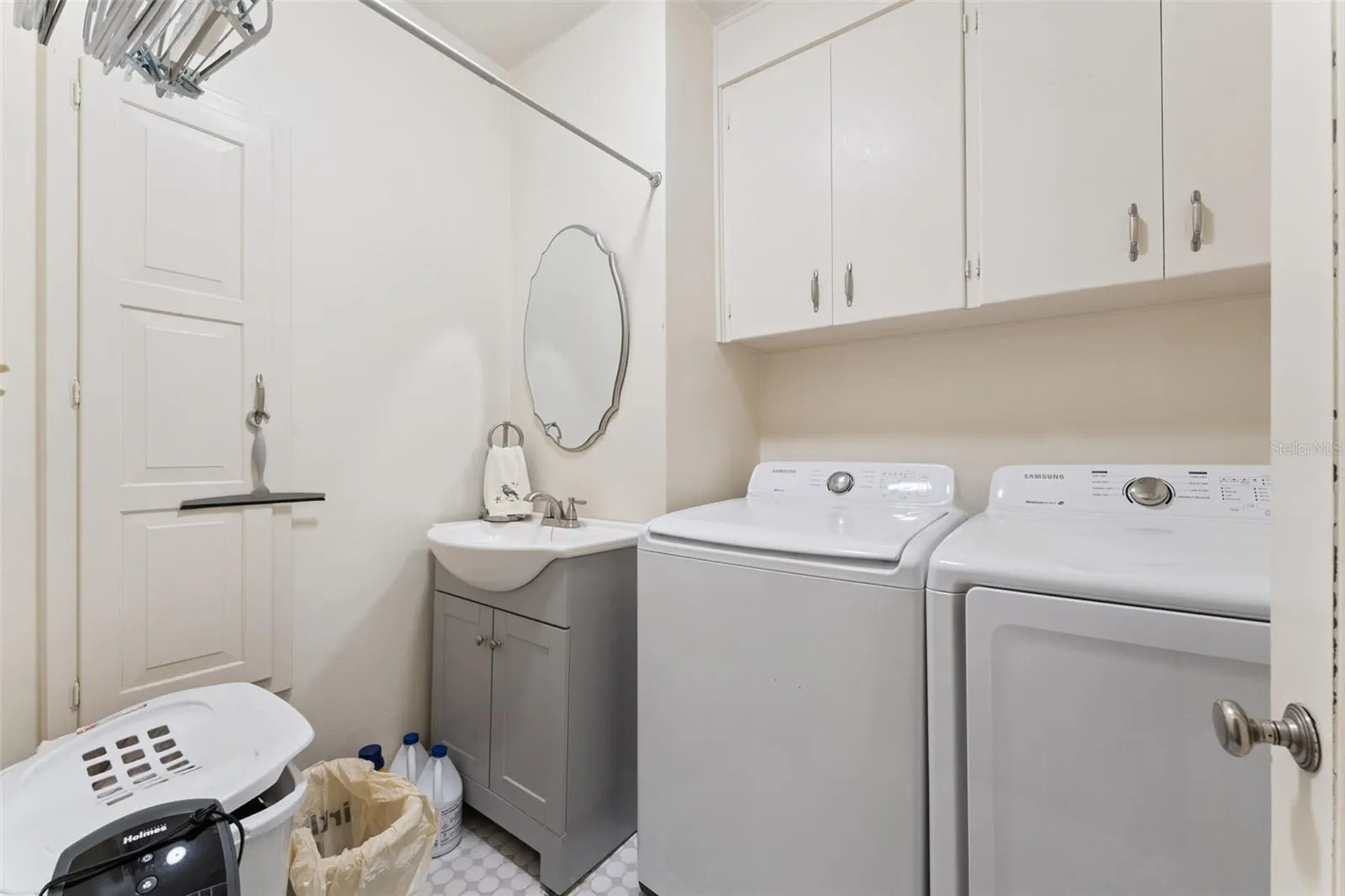 Dedicated laundry room with full-size washer and dryer
