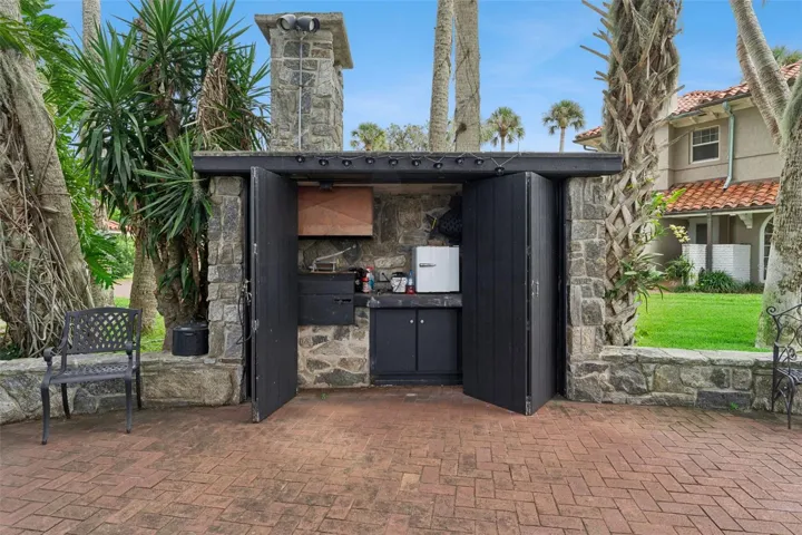 Custom stone gazebo for lakeside entertaining and al fresco dining