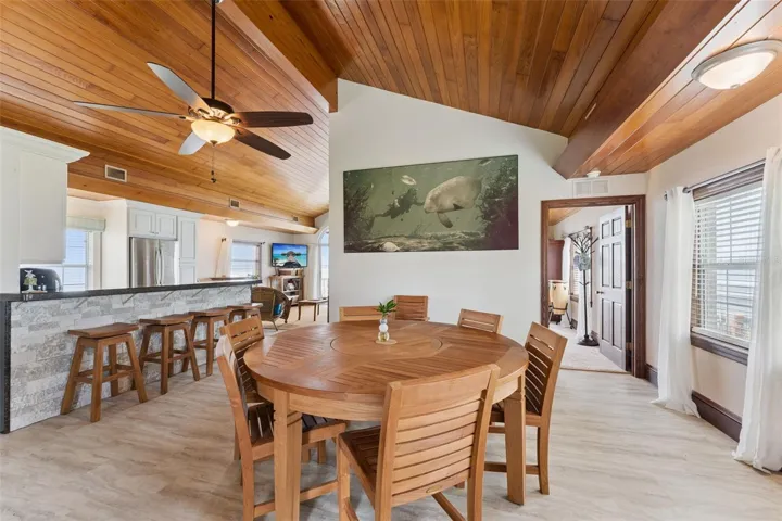 Casual dining with vaulted wood ceiling, perfect for everyday lakeside living