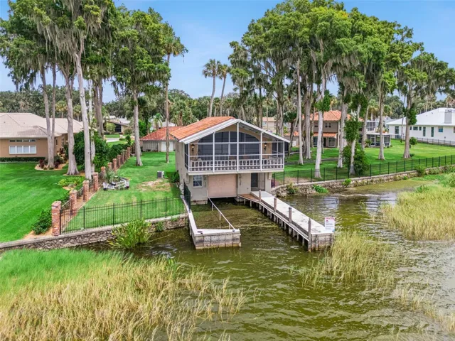 Private dock with covered boathouse on Lake Harris, one of Central Florida's premier boating lakes