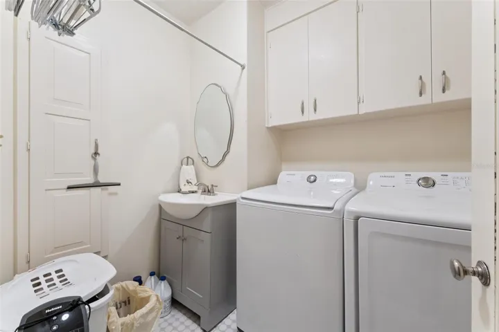 Dedicated laundry room with full-size washer and dryer