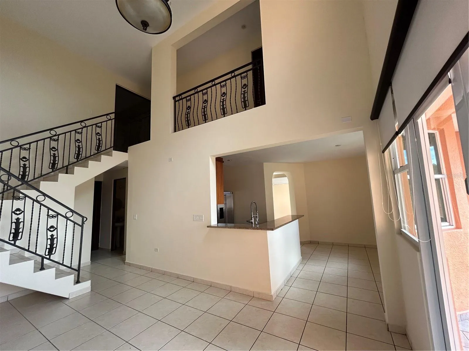Double height ceilings Family room