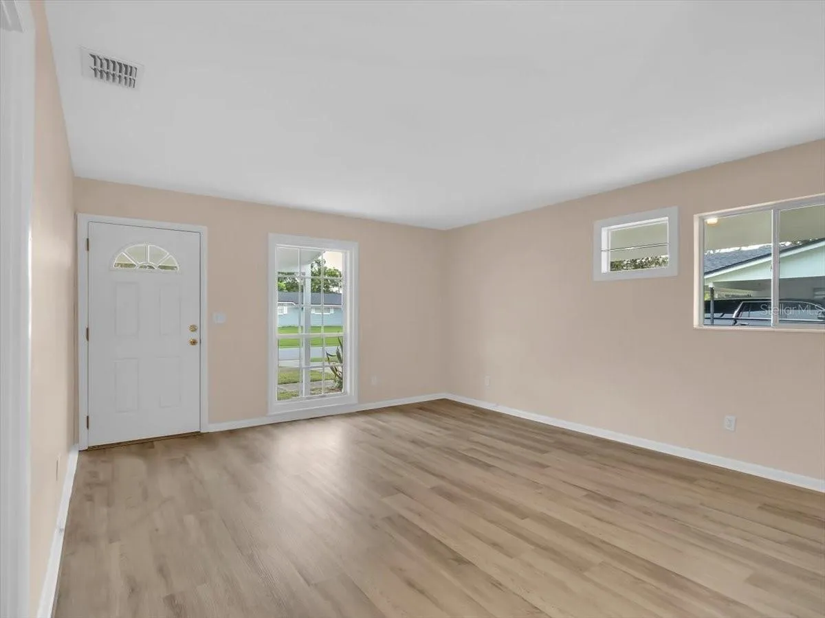 Living room, Fresh Paint including all the doors and trim &amp; New Flooring !