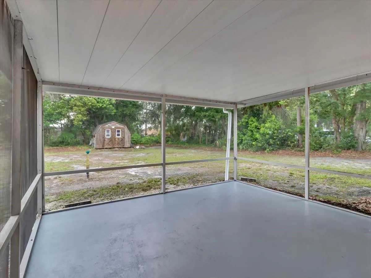 Screened Covered Lanai, Concrete is  Freshly painted, Shed has a Workshop with Electric .