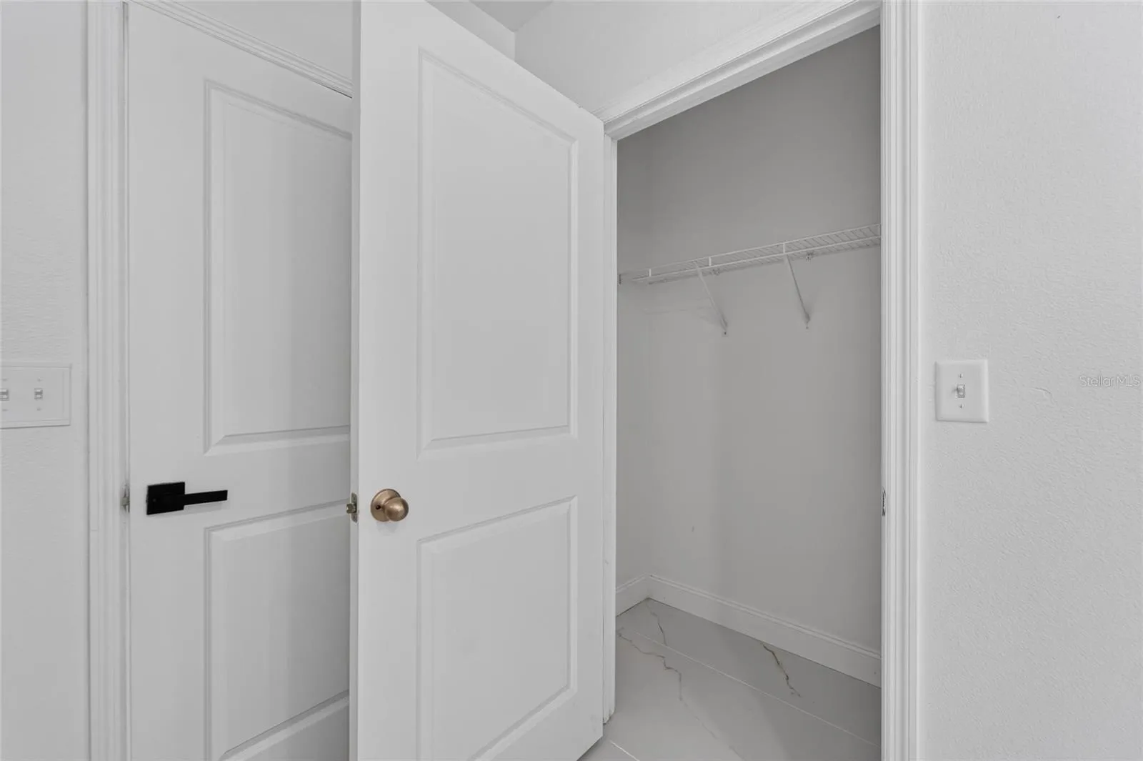 Primary Bedroom Closet 1 of 2