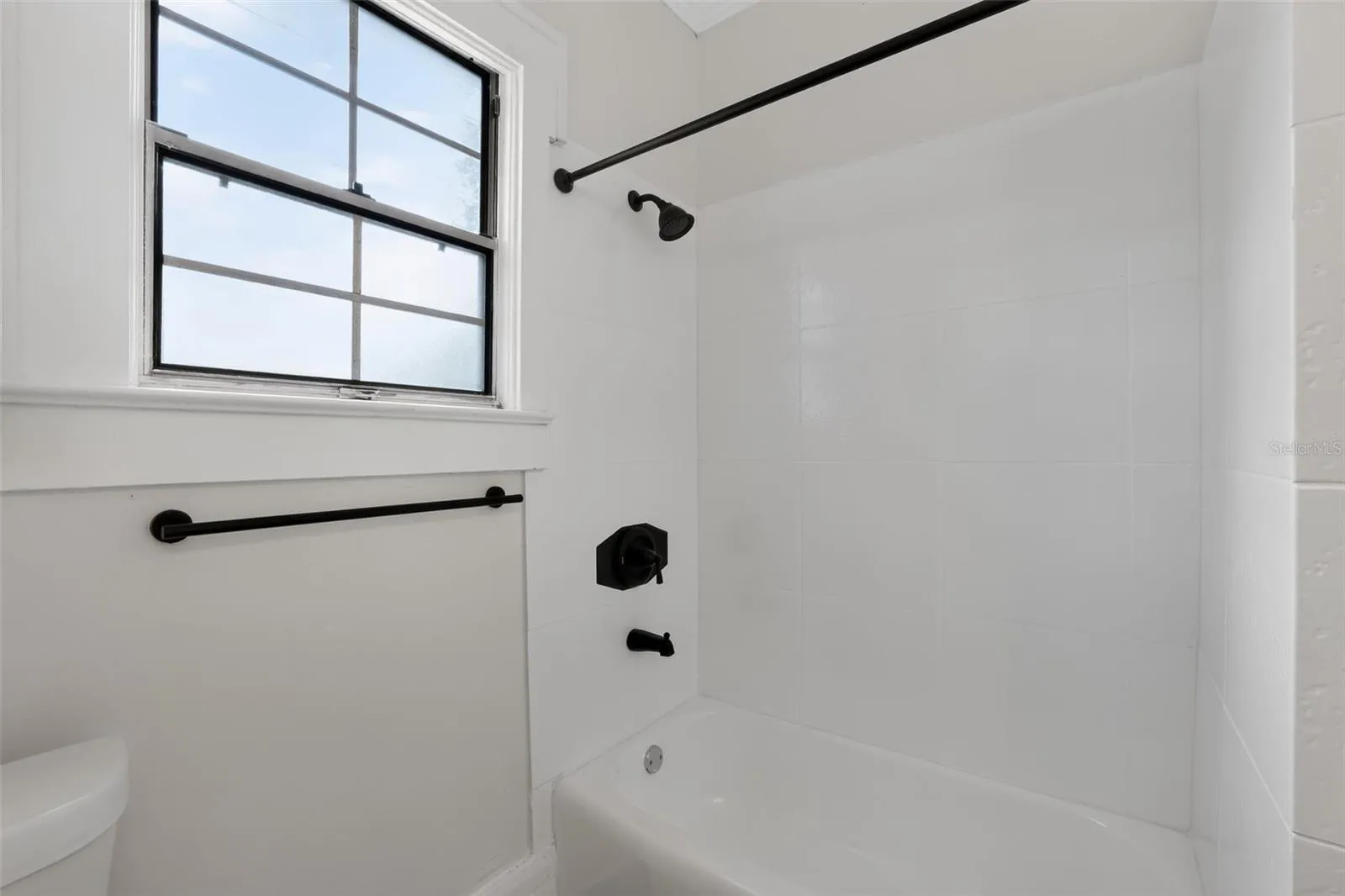Bright and clean main bathroom in this charming 1922 bungalow