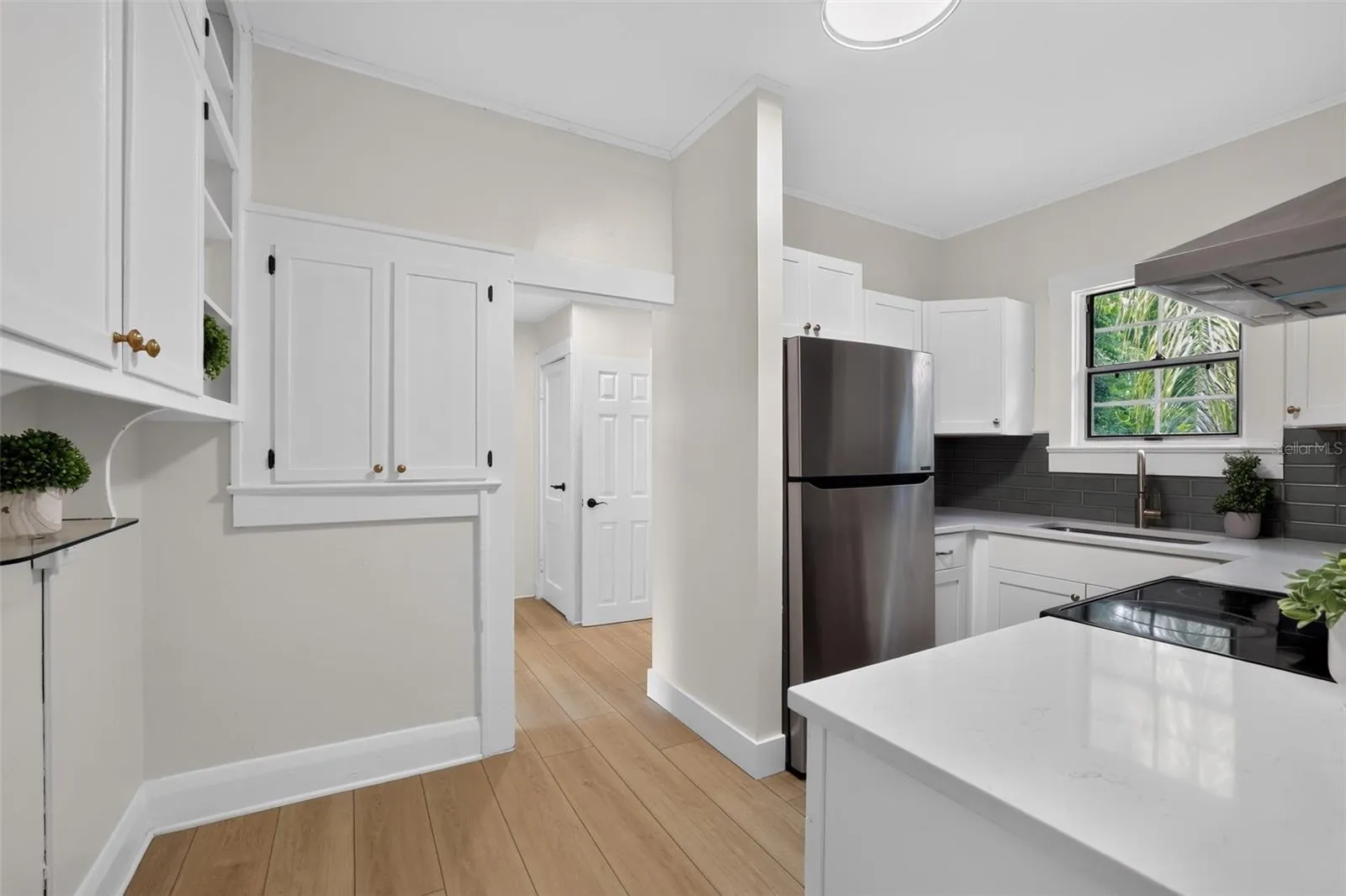 Bright and open kitchen view in this charming 1922 bungalow
