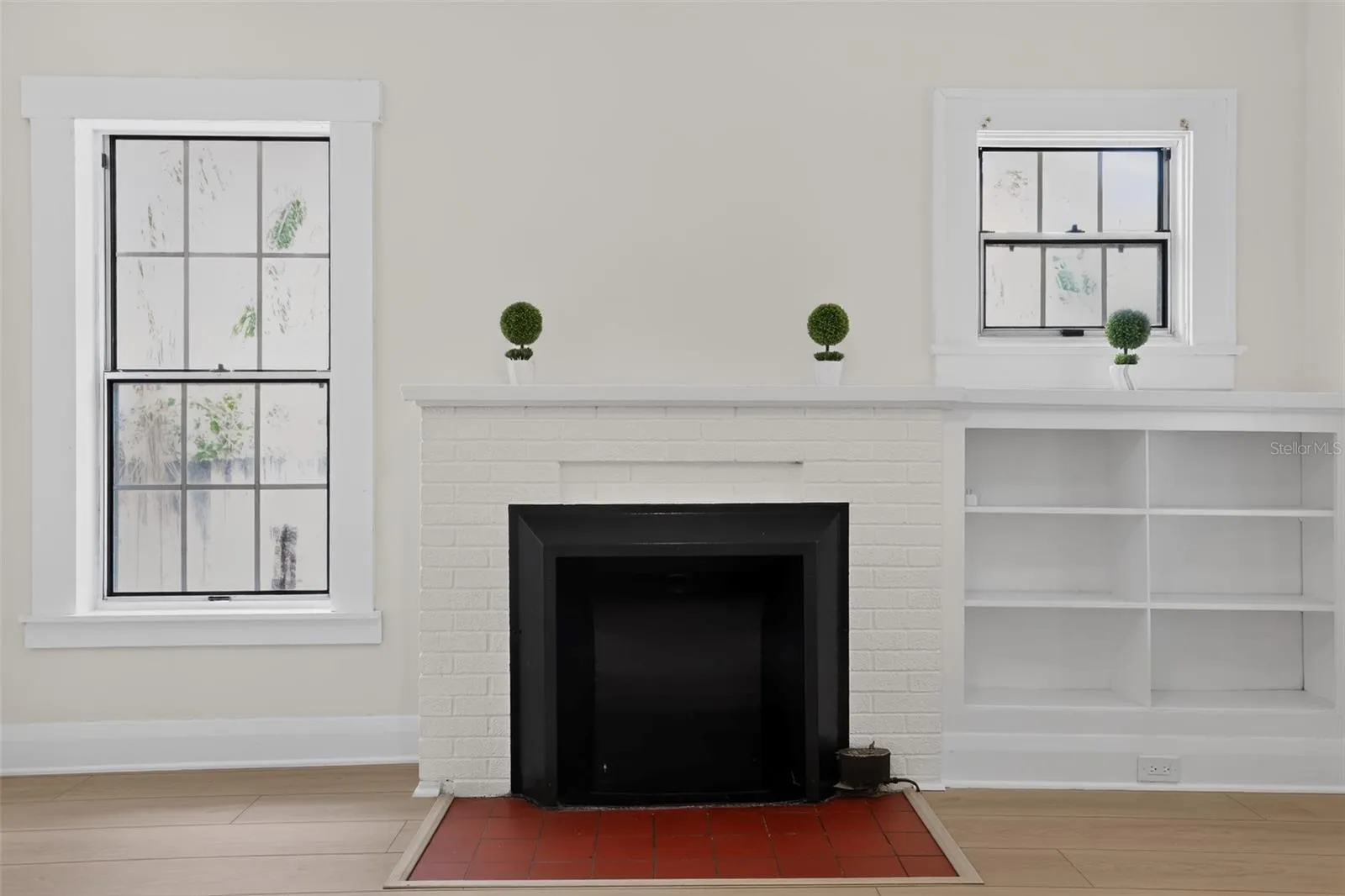 Original fireplace detail in the living room of this charming 1922 bungalow