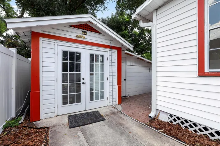 Detached garage with French doors offering parking, laundry, and storage space
