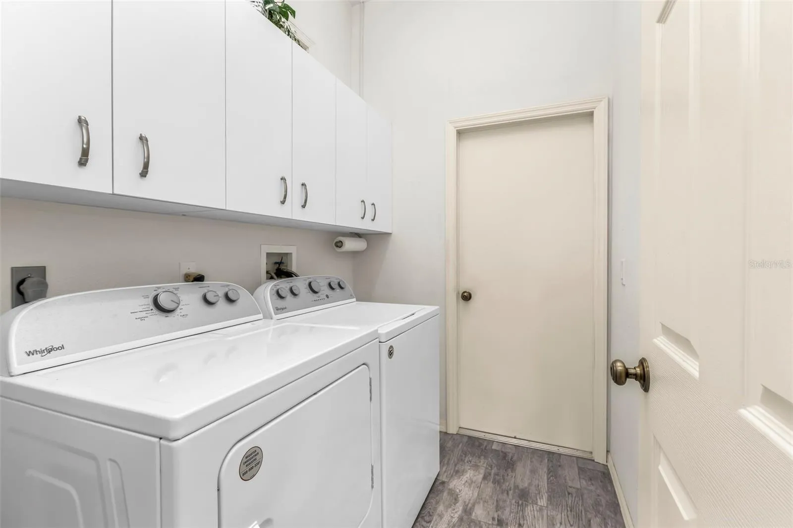 Laundry room with extra cabinets.