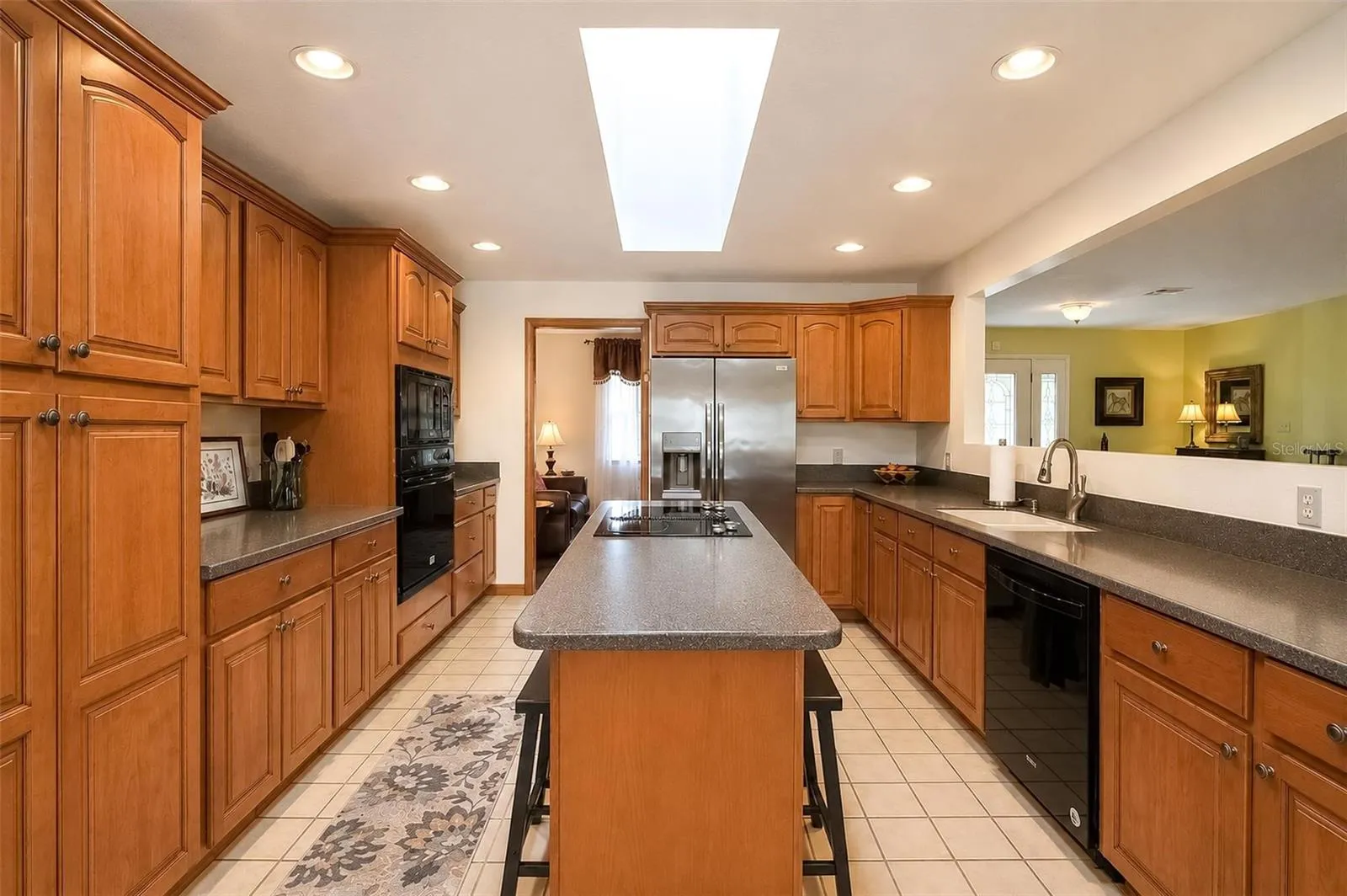 Kitchen has Maple Cabinets and Corian Counters