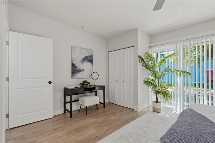 Primary with door to exterior and 1of 2 closets