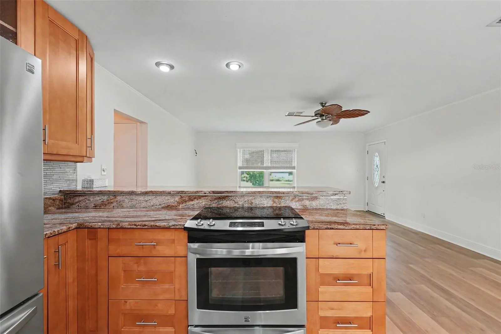 Kitchen Open to Living Room.  Most of the condos have a solid wall separating the kitchen from the living area.