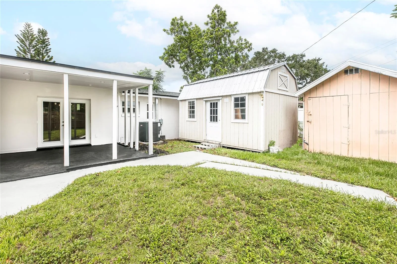 back yard with two storage shed