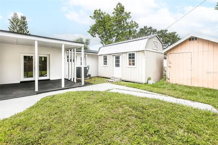 back yard with two storage shed