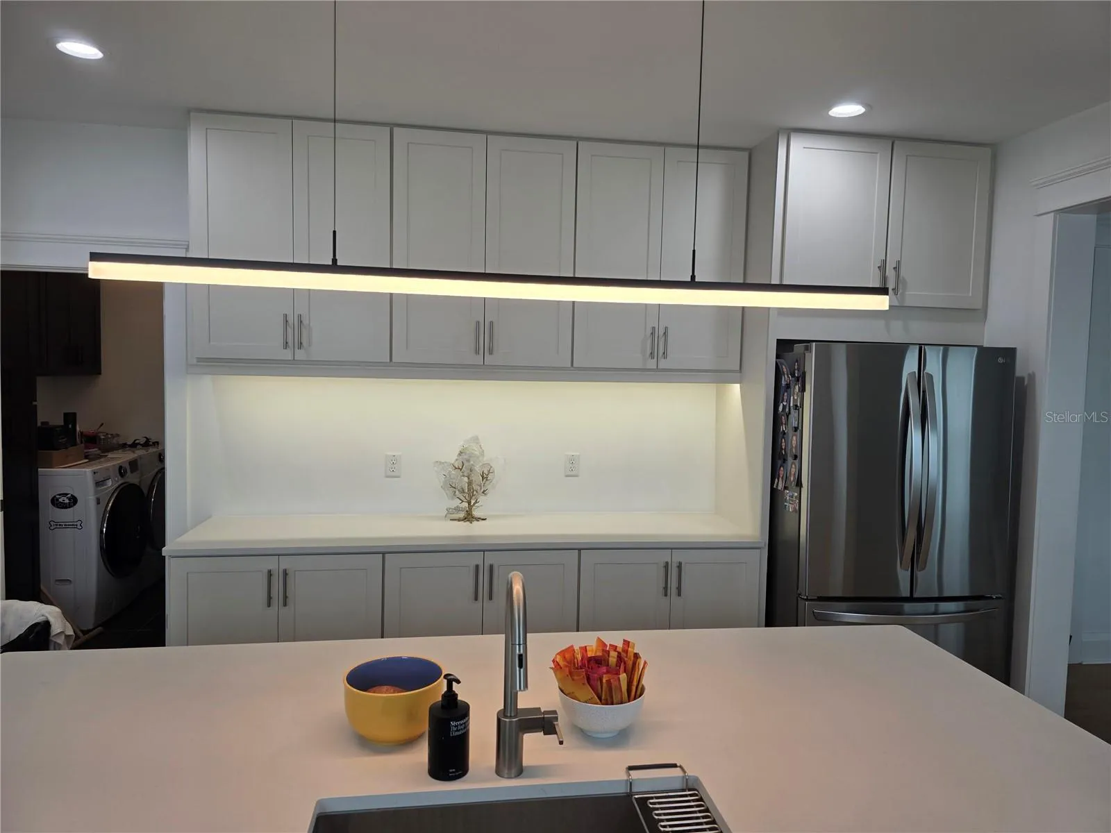 sleek, modern lighting and plenty of counter space and storage