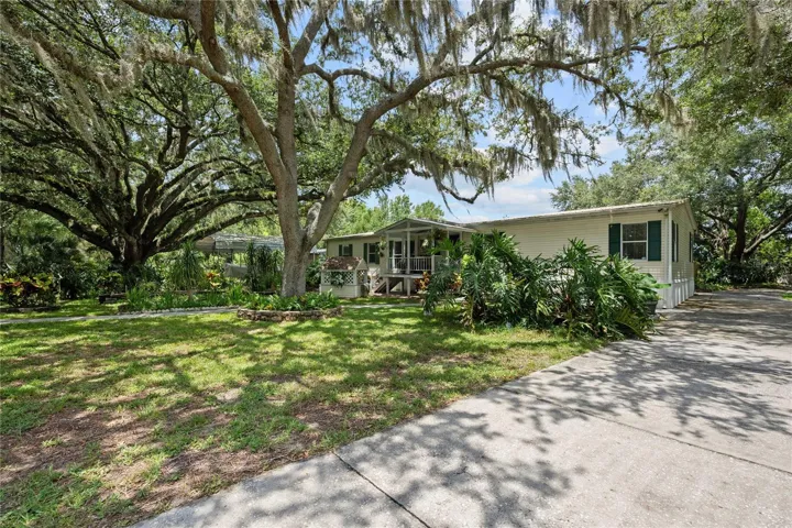 Welcome to this well-maintained home with beautiful oak and fruit trees.