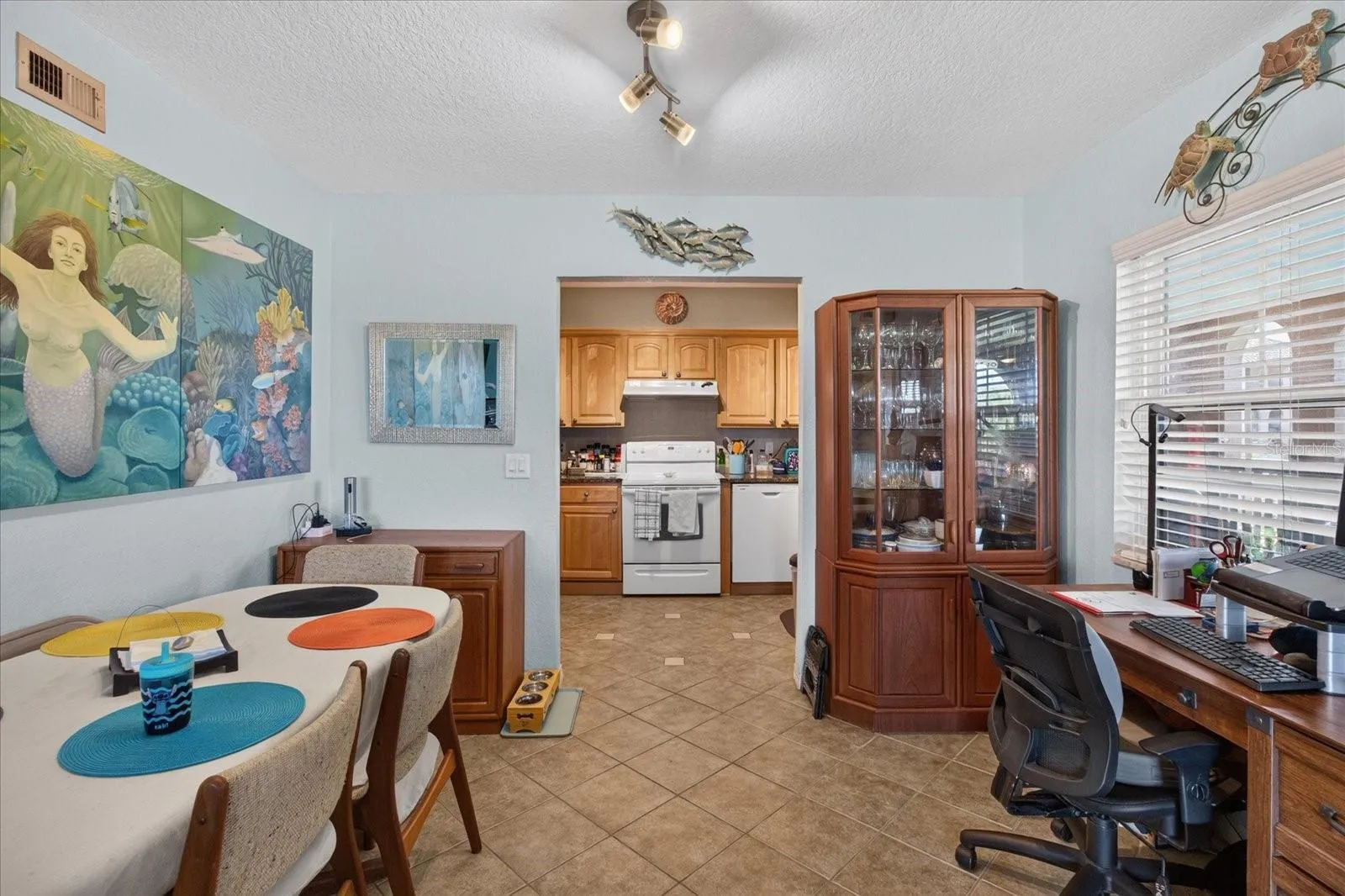Dining Area That Leads to The Kitchen.Tile Floors In The Kitchen & Dining Area