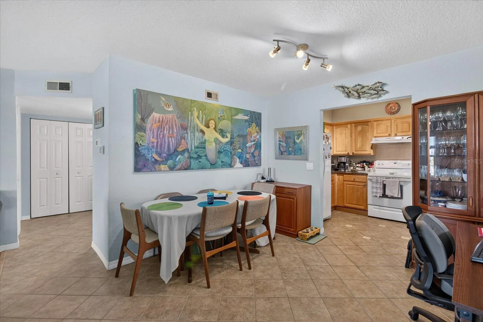 Dining Area That Leads to The Kitchen.Tile Floors In The Kitchen & Dining Area