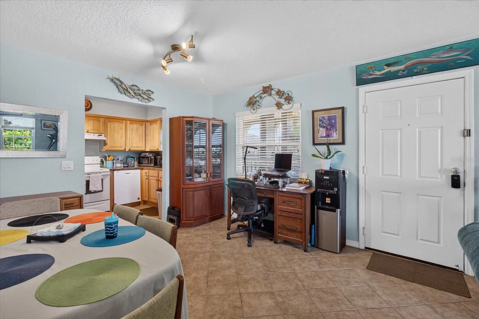 Dining Area That Leads to The Kitchen.Tile Floors In The Kitchen & Dining Area