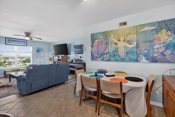 Dining Area That Leads to The Kitchen.Tile Floors In The Kitchen & Dining Area