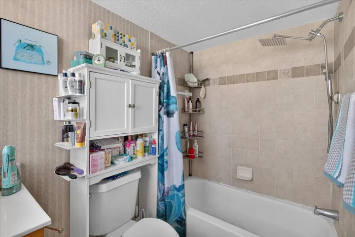 Primary Bathroom With A Tub/Shower Combo