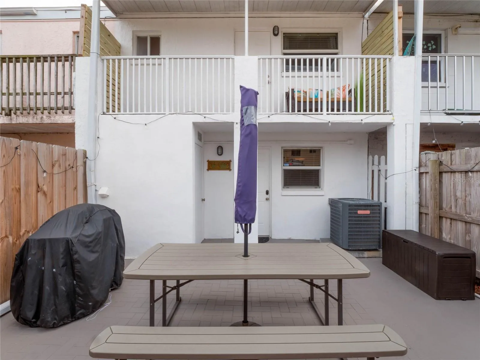 Private backyard patio creates an inviting outdoor living area.
