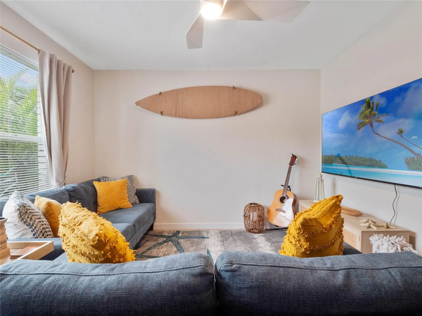 Living room overlooking the dining area, creating a spacious and connected layout.