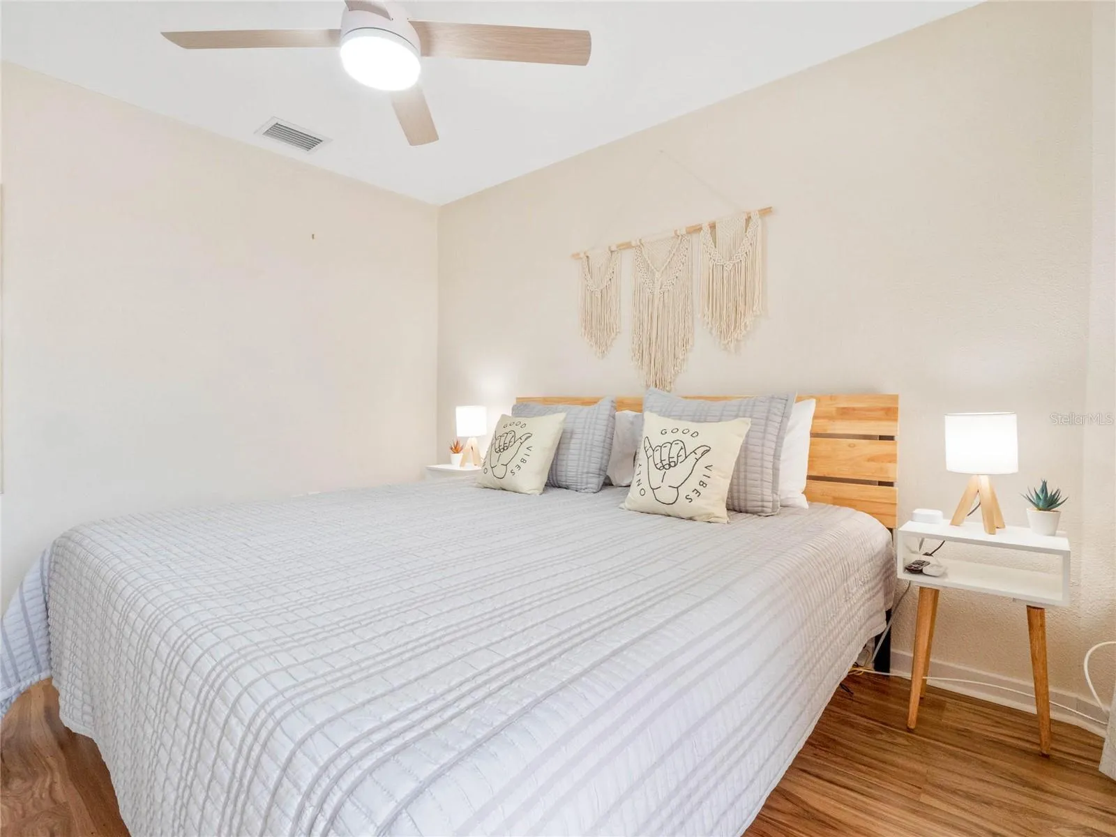Primary bedroom filled with natural light and comfortable living space.