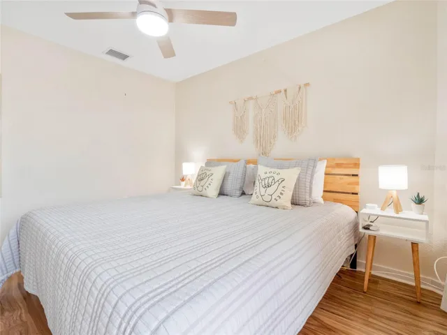 Primary bedroom filled with natural light and comfortable living space.