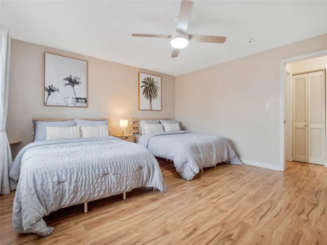 Spacious guest bedroom with room for multiple beds, ideal for family and guests.