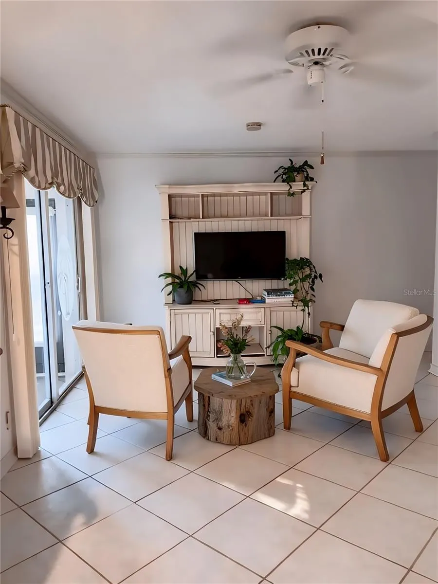 Family Room staged/ Sliders  leading to lanai