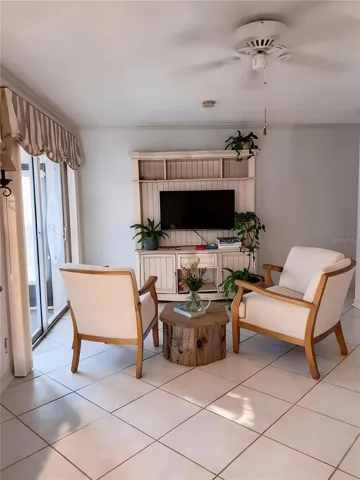 Family Room staged/ Sliders  leading to lanai