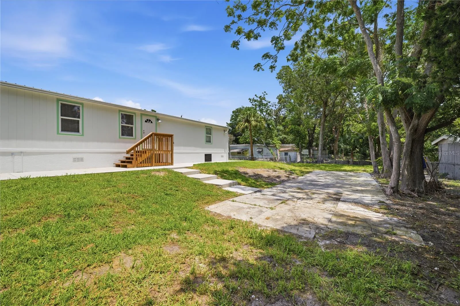 large concrete pad for more parking  or a shed