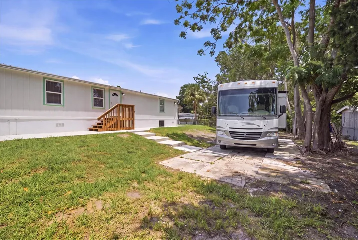 long concrete pad in backyard