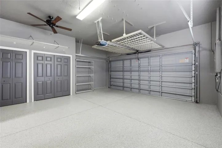 Spotless Garage with Storage Closets & Hanging Racks