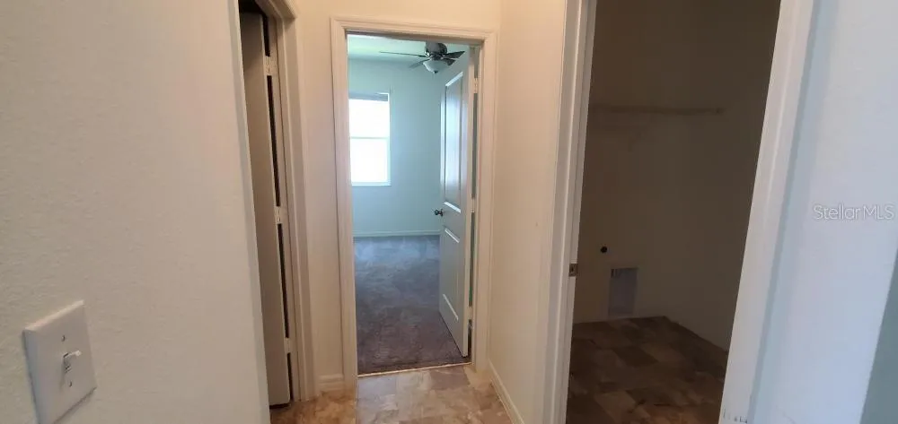 DOWNSTAIRS HALL TO BEDROOM 4, LAUNDRY ROOM & FULL BATH ROOM