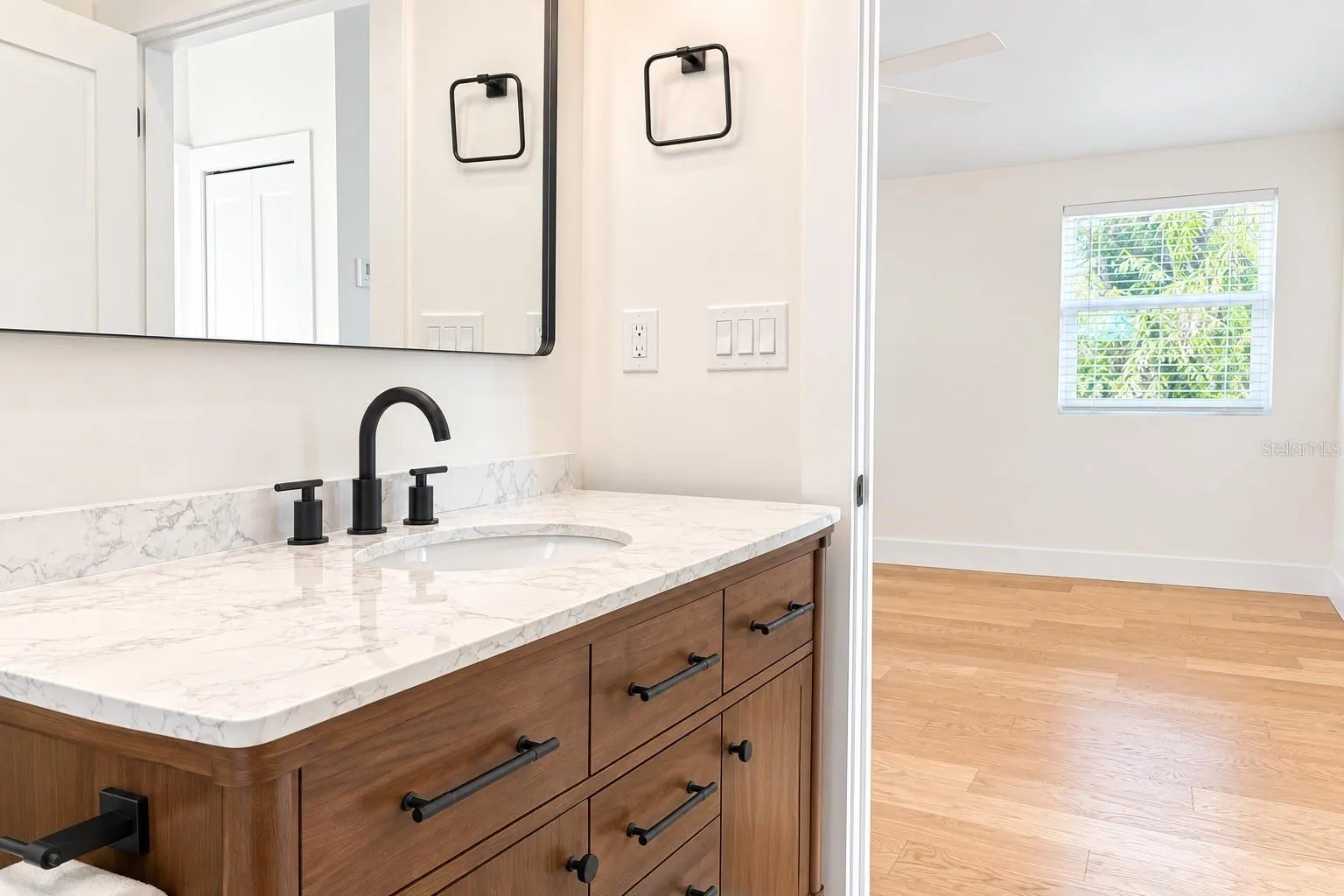 This angle showcases the bathroom's elegant design, quality finishes, and functional layout.