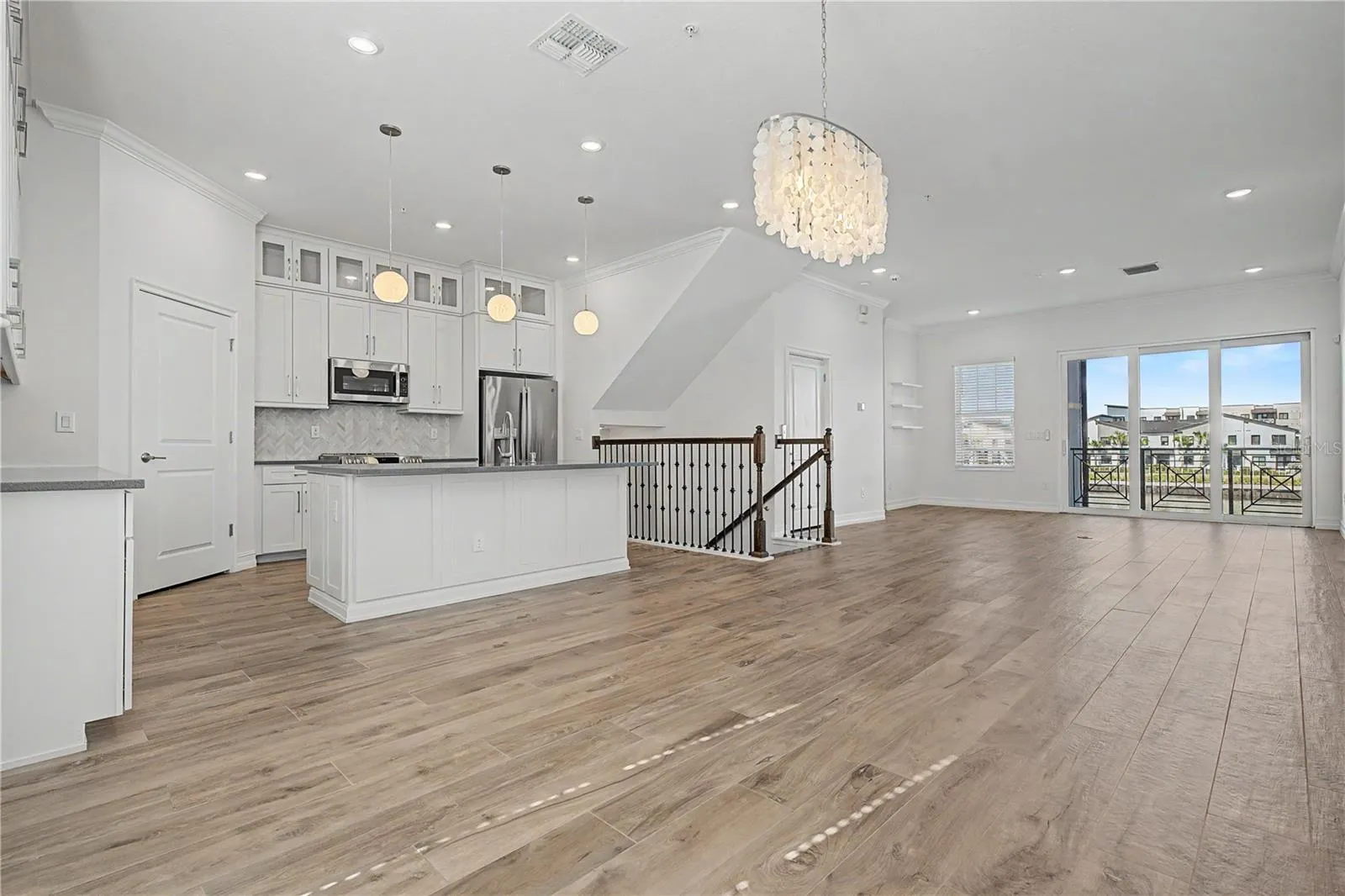 Second-level kitchen/dining  opening seamlessly to the living area.