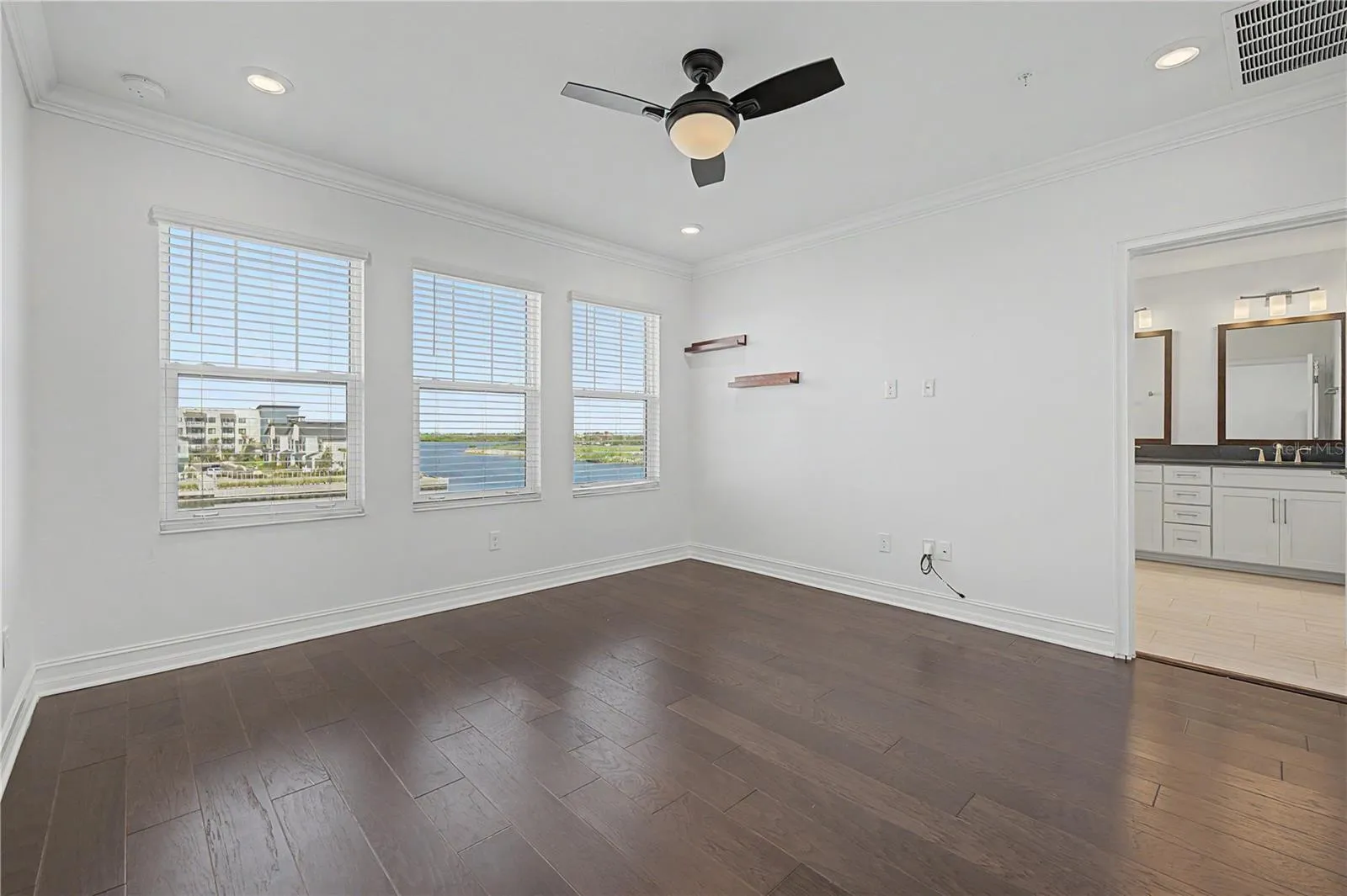 Third-level primary bedroom with a private en-suite bathroom.