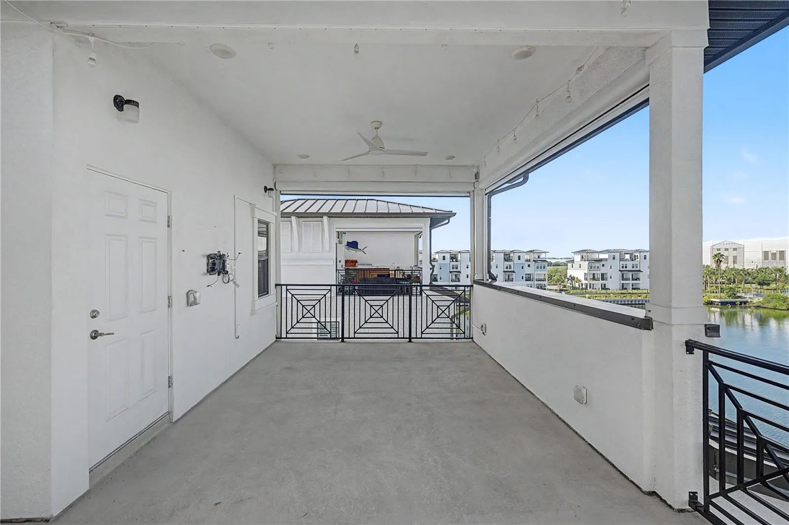 Fourth-level outdoor patio with large seating area.