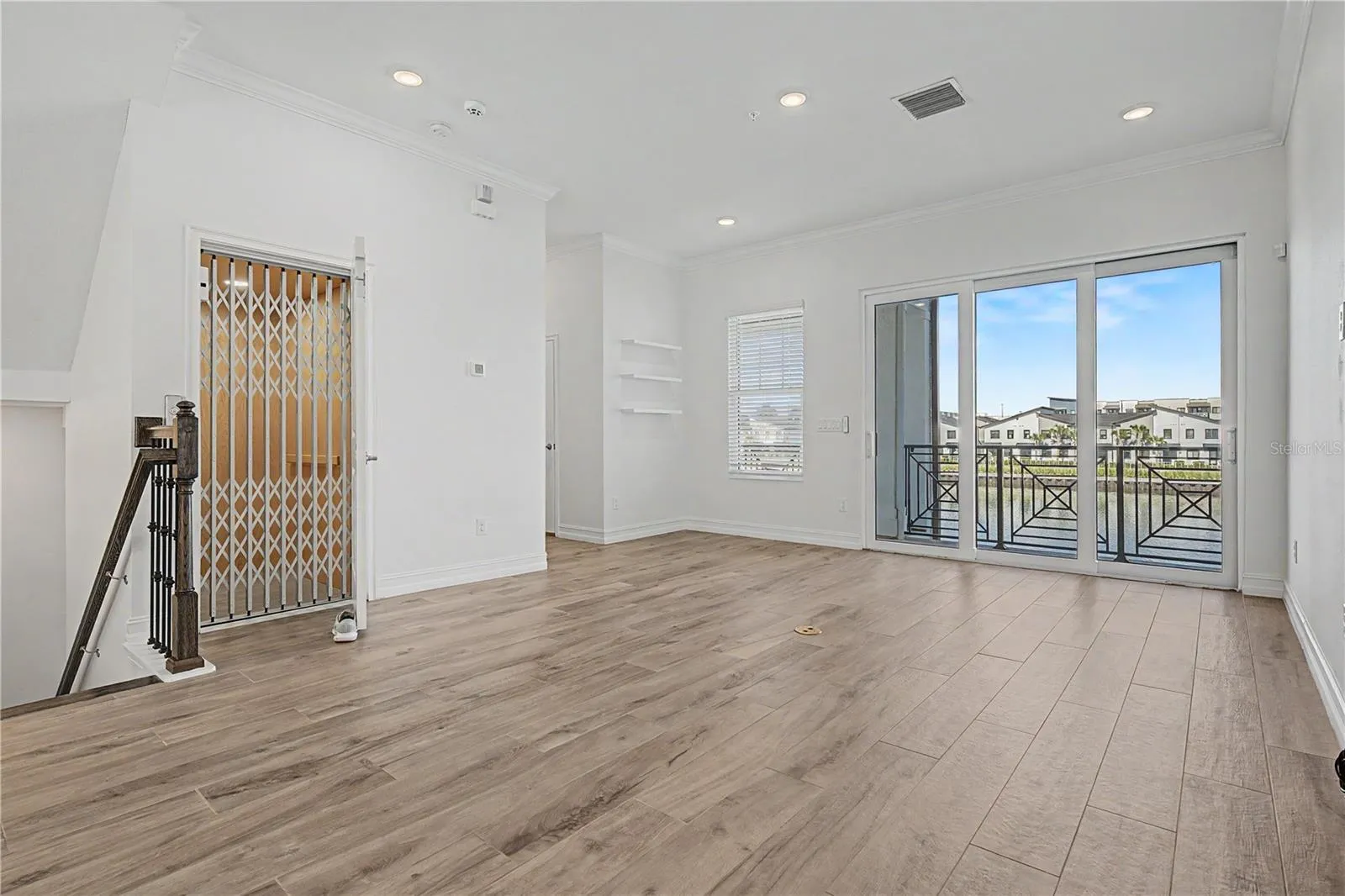Second-level living area-elevator-doors to second floor balcony
